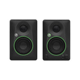 Pair of black studio monitors with green accents on a white background