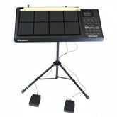 Electronic drum pad with stand and foot pedals on a white background