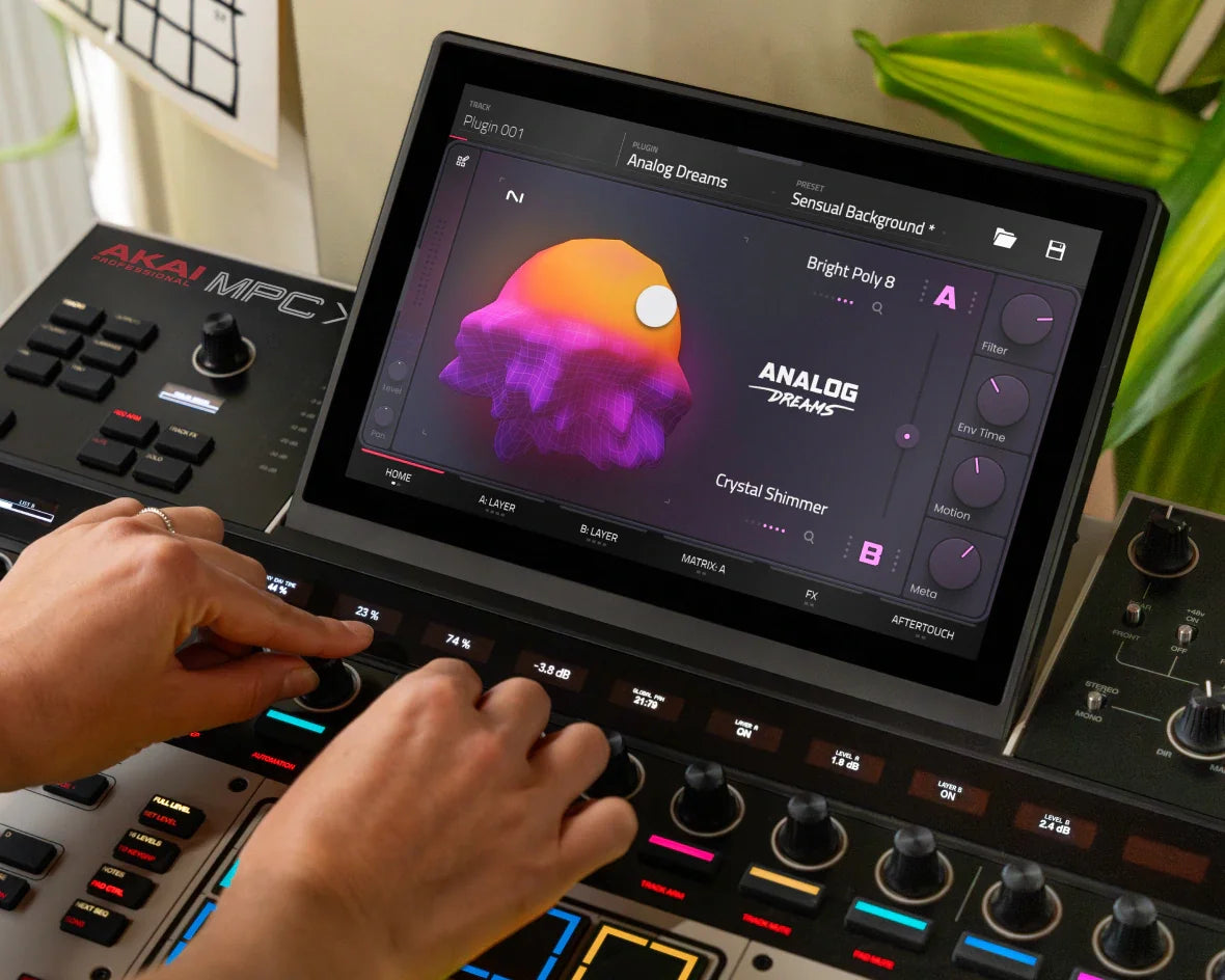 Music production setup with a tablet displaying audio software on a digital audio workstation.