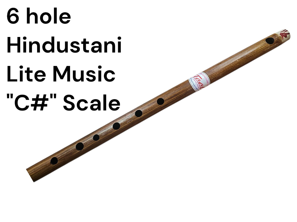 Wooden flute with 6 holes on a white background, labeled as '6 hole Hindustani Lite Music C# Scale'.
