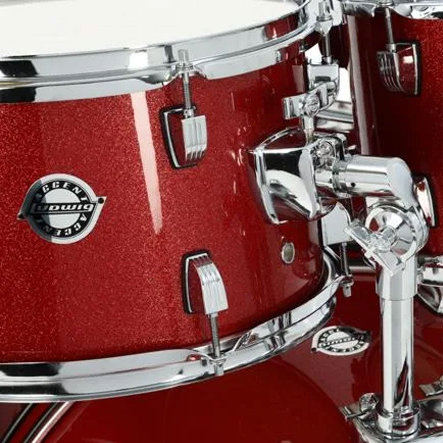Close-up of a red snare drum with chrome hardware
