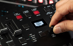 Hand interacting with a digital music controller