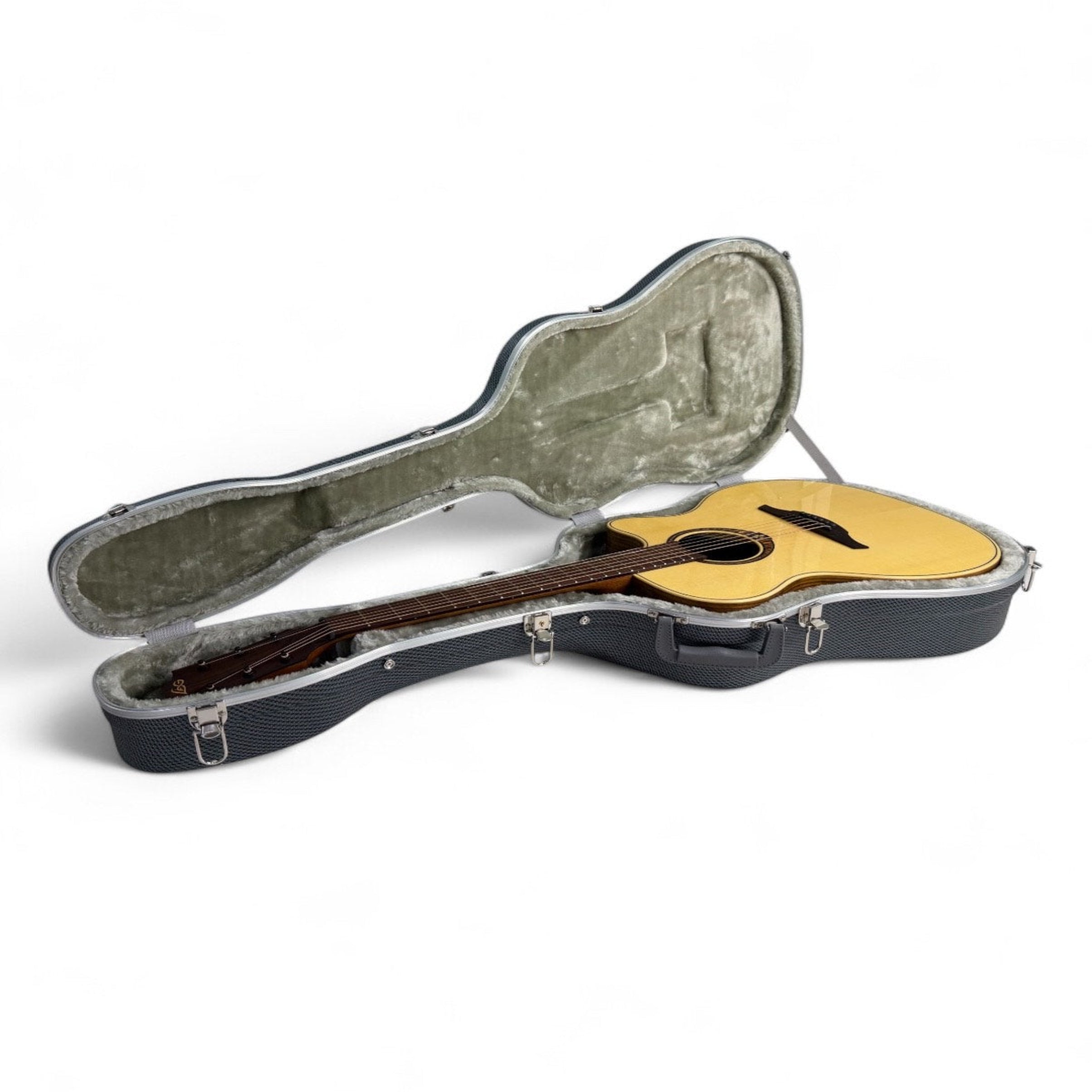 Acoustic guitar in an open hardshell case 