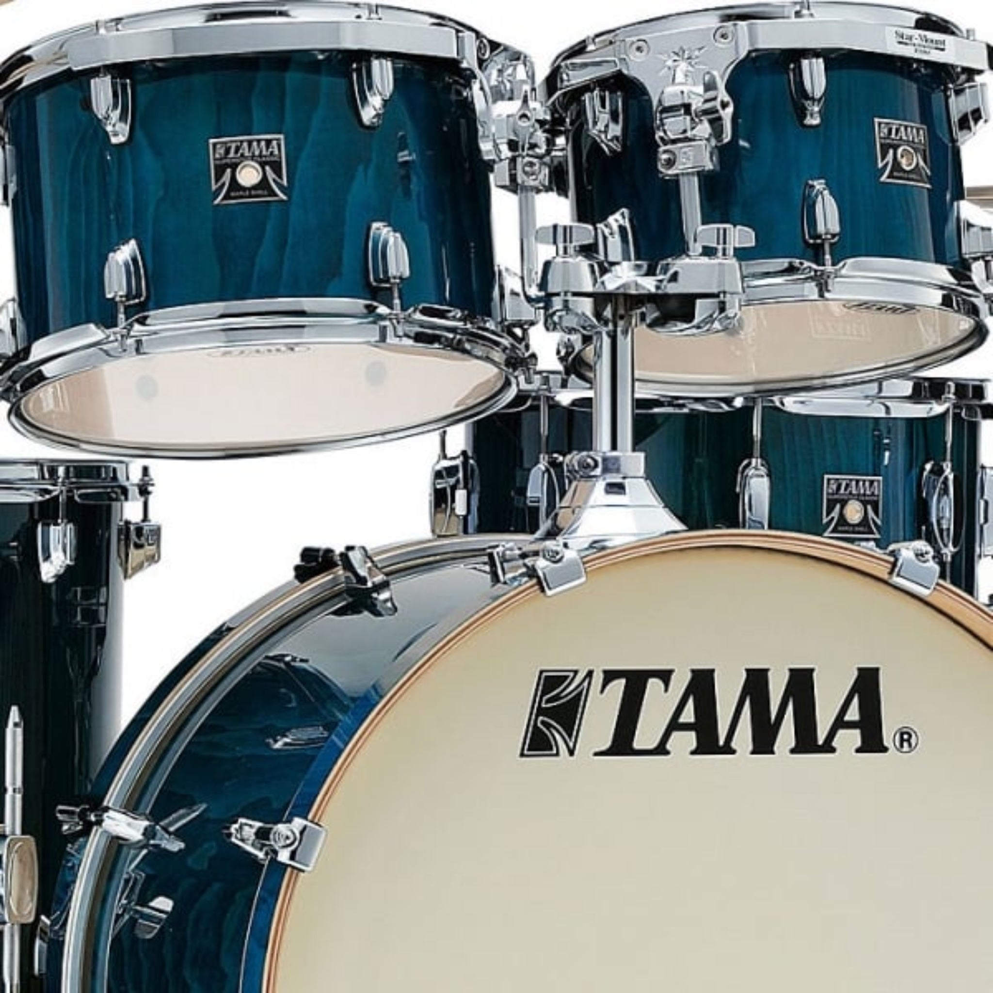 Tama drum set with blue drums and visible brand logo.
