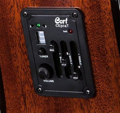 Guitar amplifier control panel with 'Cort' branding on a wooden surface