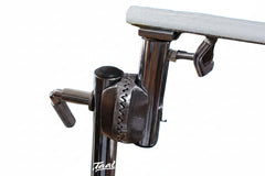 Close-up of a metal clamp with a textured grip on a white background
